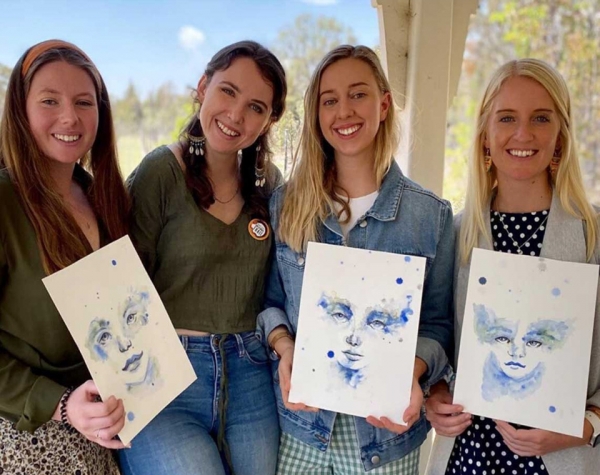 4 ladies displaying their artworks