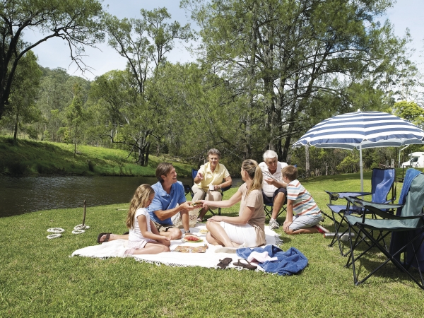 family having a picnic by the Condamine river Warwick