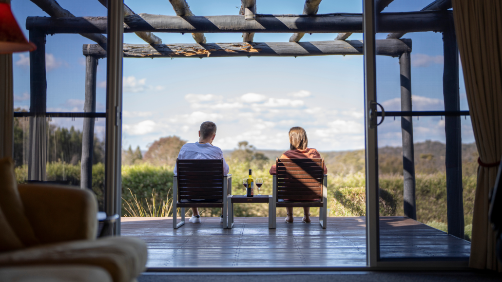 Two people looking at a view from Alure Stanthorpe accommodation